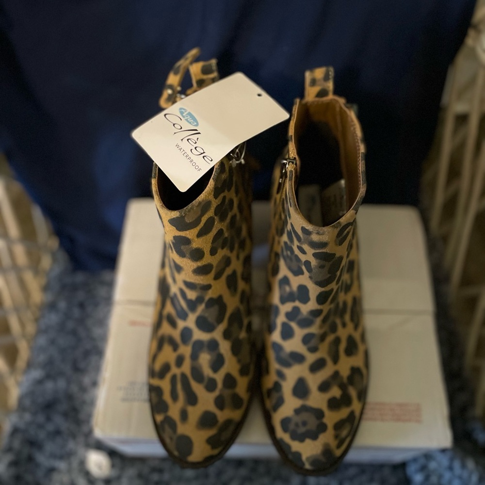 New with tags waterproof leather animal print boots. Sold at Macy’s.